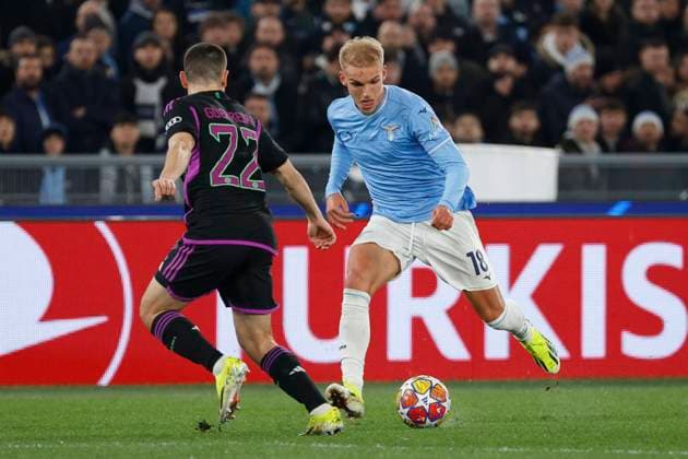 14th February 2024, Stadio Olimpico, Rome, Italy; Champions League Football, Round of 16, First Leg; Lazio versus Bayern Munich; Gustav Isaksen of Lazio takes on Raphael Guerreiro of Bayern  ActionPlus12608958 NaFoto