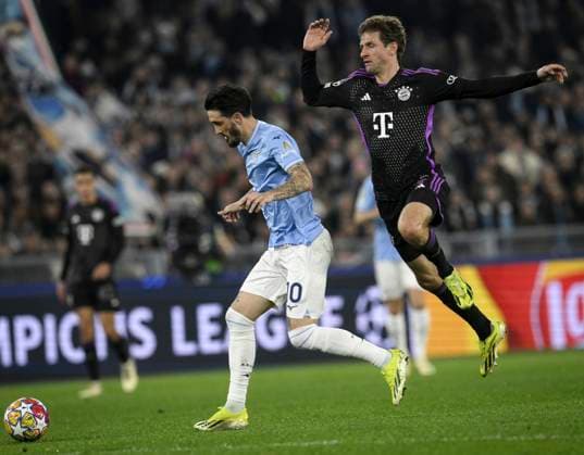 FOOTBALL CHAMPIONS LEAGUE SEASON 2023 2024 Round of 16 first leg 14 02 2024 Lazio Rome FC Bayern Muenchen Thomas Mueller right, FC Bayern Muenchen v Luis Alberto left, Lazio Rome