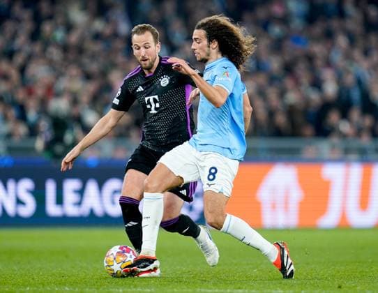 Lazio v FC Bayern Munich - UEFA Champions League Matteo Guendouzi of SS Lazio and Harry Kane of FC Bayern Munich compete for the ball during the UEFA Champions League Round of 16 match between SS Lazio v FC Bayern Munich at Stadio Olimpico Roma on February 14, 2024 in Rome, Italy. Rome Stadio Olimpico Rome Italy Copyright: xGiuseppexMaffiax UCL_Lazio-BayernMunich_GM_140224_LIA0077