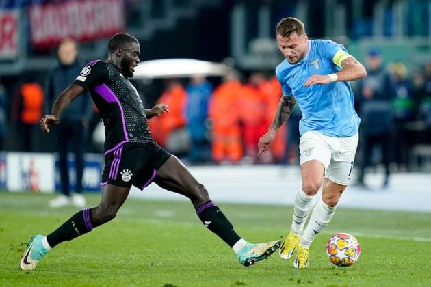 Lazio v FC Bayern Munich - UEFA Champions League Dayot Upamecano of FC Bayern Munich and Ciro Immobile of SS Lazio compete for the ball during the UEFA Champions League Round of 16 match between SS Lazio v FC Bayern Munich at Stadio Olimpico Roma on February 14, 2024 in Rome, Italy. Rome Stadio Olimpico Rome Italy Copyright: xGiuseppexMaffiax UCL_Lazio-BayernMunich_GM_140224_LIA0146