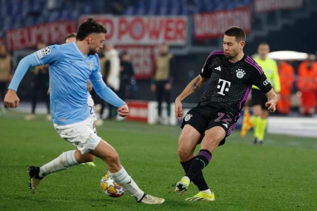 14th February 2024, Stadio Olimpico, Rome, Italy; Champions League Football, Round of 16, First Leg; Lazio versus Bayern Munich; Rapha& xeb;l Guerreiro of Bayern passes under pressure  ActionPlus12609001 NaFoto