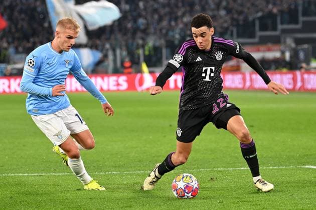 Rome, Stadio Olimpico, 14 02 24, GER, Men, UEFA Champions League, Season 2023 2024, Lazio Rom FC Bayern Muenchen Picture from left in duel Gustav ISAKSEN Lazio and Jamal MUSIALA Muenchen Only for editorial use UEFA regulations prohibit any use of photographs as image sequences and or quasi video Italy
