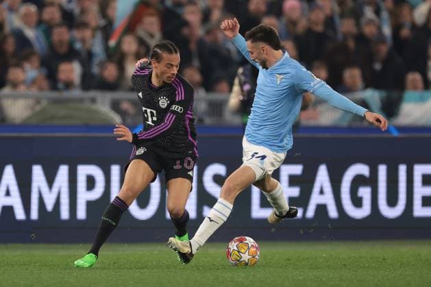 Rome, Italy, 14th February 2024. Leroy Sane of Bayern München takes on Mario Gila of SS Lazio during the UEFA Champions League match at Olimpico, Rome. Picture credit should read: Jonathan Moscrop Sportimage EDITORIAL USE ONLY. No use with unauthorised audio, video, data, fixture lists, club league logos or live services. Online in-match use limited to 120 images, no video emulation. No use in betting, games or single club league player publications. SPI-2933-0019