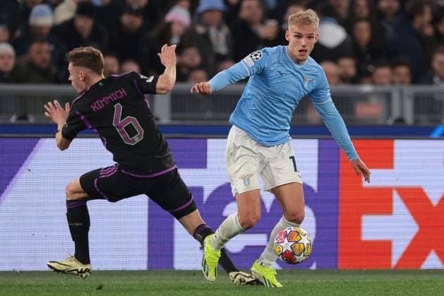 Rome, Italy, 14th February 2024. Gustav Isaksen of SS Lazio takes on Joshua Kimmich of Bayern Munchen during the UEFA Champions League match at Olimpico, Rome. Picture credit should read: Jonathan Moscrop Sportimage EDITORIAL USE ONLY. No use with unauthorised audio, video, data, fixture lists, club league logos or live services. Online in-match use limited to 120 images, no video emulation. No use in betting, games or single club league player publications. SPI-2933-0071