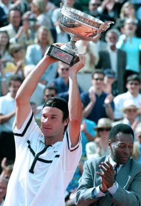 7 Jun 1998: Carlos Moya of Spain lifts the trophy after victory in the French Open final against Alex Corretja at Roland Garros in Paris. 