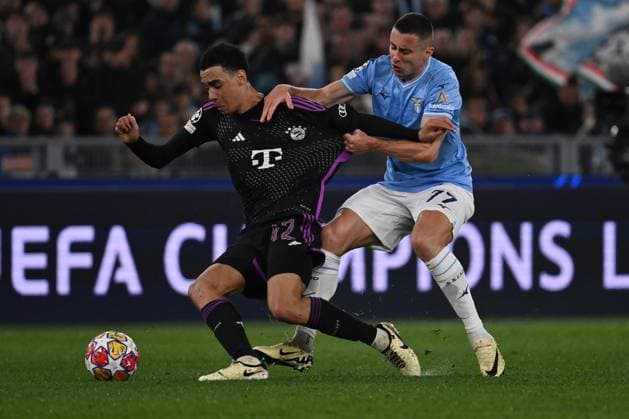 Sport Bilder des Tages Jamal Musiala of F.C. Bayern Munchen and Adam Marusic of S.S. Lazio during the round of 16 of the UEFA Champions League between S.S. Lazio vs F.C. Bayern Munich on 14 February 2024 at the Olympic Stadium in Rome, Italy.  Copyright: xDomenicoxCippitelli IPAxSportx x xx IPA_43441543 IPA_Agency_IPA43441543