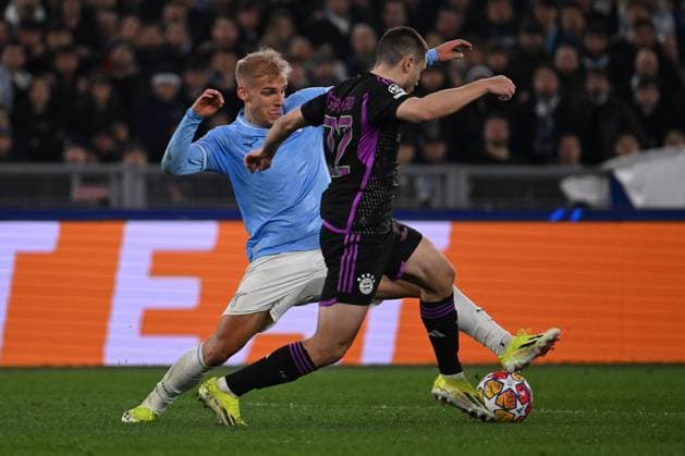 Gustav Isaksen of S.S. Lazio and Raphael Guerreiro of F.C. Bayern Munchen during the round of 16 of the UEFA Champions League between S.S. Lazio vs F.C. Bayern Munich on 14 February 2024 at the Olympic Stadium in Rome, Italy.  Copyright: xDomenicoxCippitelli IPAxSportx x xx IPA_43441652 IPA_Agency_IPA43441652