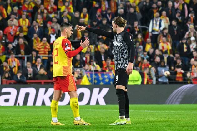 R Aguilar ( 2 - Lens ) and Lucas Holer ( 9 - Fribourg ) during the UEFA Europa League match between Racing Club Lens and SC Freiburg at Stade Felix Bollaert on February 15, 2024 in Lens, France. ( Photo by federico pestellini panoramic ) - FOOTBALL : Lens vs Fribourg - Europa League - 15 02 2024 FedericoPestellini Panoramic 