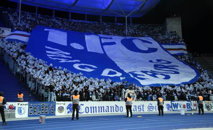 Giant logo choreography in Magdeburg fan block Sport Soccer Football DFL 2 Bundesliga Men 22 Matchday Season 2023 2024 16 02 2024 Hertha BSC Berlin vs 1 FC Magdeburg FCM DFL regulations prohibit any use of photographs as image sequences and or quasi video