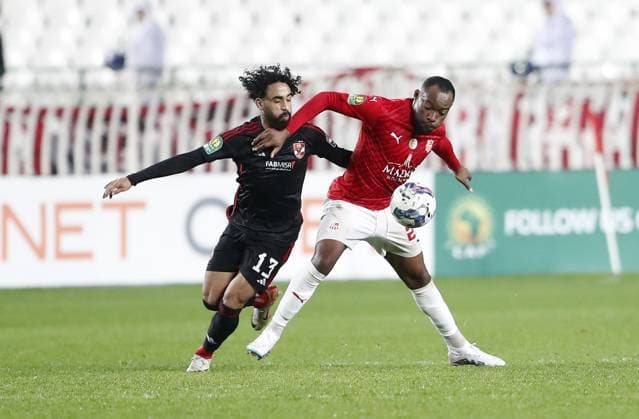 (240217) -- ALGIERS, Feb. 17, 2024 -- CR Belouizdad s Leonel Wamba Djouffo (R) vies with Al Ahly s Marwan Attia during the CAF Champions League 2023 2024 football match between CR Belouizdad of Algeria and Al Ahly of Egypt at 5th July Stadium in Algiers, Algeria, Feb. 16, 2024. (SP)ALGERIA-ALGIERS-FOOTBALL-CAF CHAMPIONS LEAGUE-CR BELOUIZDAD VS AL AHLY(5) (Xinhua) 