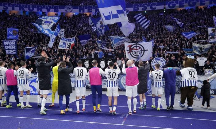 Hertha team celebrates 3 2 victory in front of the fans, behind DFL logo in crosshairs Sports Football Soccer DFL 2 Bundesliga Men 22 Matchday Season 2023 2024 16 02 2024 Hertha BSC Berlin vs 1 FC Magdeburg FCM DFL regulations prohibit any use of photographs as image sequences and or quasi video