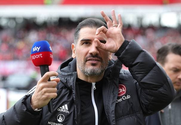 18 02 2024 Soccer Season 2023 2024 2 Soccer Bundesliga 22 Matchday 1 FC Nürnberg FCN Club 1 FC Kaiserslautern FCK Roten Teufel Sportfoto Zink DaMa xdaxmax DFL regulations prohibit any use of photographs as image sequences and or quasi video only for editorial use Cristian Fiel Trainer 1 FC Nürnberg FCN forms binoculars with his fingers and looks through towards Clubfan Clubfans FCN Fans Fans