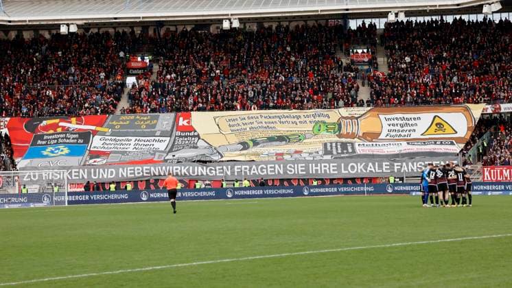 Picture from left Protest poster of FCN fans against the entry of investors into the DFL 18 02 2024, Football, 2 Bundesliga, 1 FC Nuernberg 1 FC Kaiserslautern, GER, Nuernberg, Max Morlock Stadion DFL REGULATIONS PROHIBIT ANY USE OF PHOTOGRAPHS AS IMAGE SEQUENCES AND OR QUASI VIDEO Copyright: HMBxMedia xHeikoxBecker