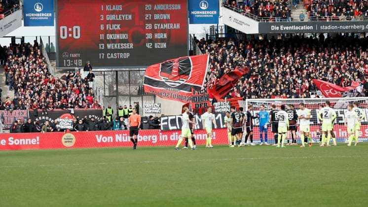 Picture from left Fans from Nuremberg enter the stadium and a protest banner against the planned entry of investors into the DFL 18 02 2024, Soccer, 2 Bundesliga, 1 FC Nuernberg 1 FC Kaiserslautern, GER, Nuernberg, Max Morlock Stadion DFL REGULATIONS PROHIBIT ANY USE OF PHOTOGRAPHS AS IMAGE SEQUENCES AND OR QUASI VIDEO Copyright: HMBxMedia xHeikoxBecker