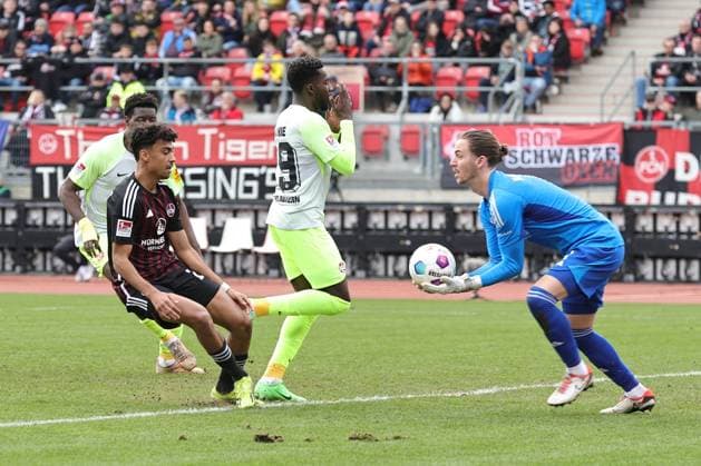 18 02 2024 Soccer Season 2023 2024 2 Soccer Bundesliga 22 Matchday 1 FC Nürnberg FCN Club 1 FC Kaiserslautern FCK Roten Teufel Sportfoto Zink DaMa xdaxmax DFL regulations prohibit any use of photographs as image sequences and or quasi video only for editorial use Carl Klaus 1, 1 FC Nürnberg FCN clears in front of Richmond Tachie 29, 1 FC Kaiserslautern FCK
