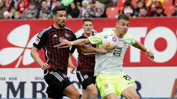 Picture from left Ahmet Guerleyen 1 FC Nuernberg, 3 and Filip Kaloc 1 FC Kaiserslautern, 26 18 02 2024, Football, 2 Bundesliga, 1 FC Nuernberg 1 FC Kaiserslautern, GER, Nuernberg, Max Morlock Stadion DFL REGULATIONS PROHIBIT ANY USE OF PHOTOGRAPHS AS IMAGE SEQUENCES AND OR QUASI VIDEO Copyright: HMBxMedia xHeikoxBecker
