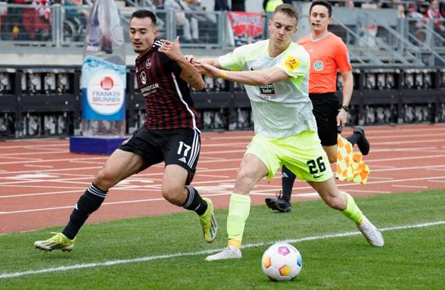 Picture from left Jens Castrop 1 FC Nuernberg, 17 and Filip Kaloc 1 FC Kaiserslautern, 26 18 02 2024, Football, 2 Bundesliga, 1 FC Nuernberg 1 FC Kaiserslautern, GER, Nuernberg, Max Morlock Stadion DFL REGULATIONS PROHIBIT ANY USE OF PHOTOGRAPHS AS IMAGE SEQUENCES AND OR QUASI VIDEO Copyright: HMBxMedia xHeikoxBecker