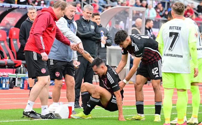 18 02 2024 Soccer Season 2023 2024 2 Soccer Bundesliga 22 Matchday 1 FC Nürnberg FCN Club 1 FC Kaiserslautern FCK Roten Teufel Sportfoto Zink xwoxzix DFL regulations prohibit any use of photographs as image sequences and or quasi video only for editorial use Prof Dr Werner Krutsch Team doctor 1 FC Nürnberg FCN Jens Vergers Physiotherapist 1 FC Nürnberg FCN Can Yilmaz Uzun 42, 1 FC Nürnberg FCN help Jens Castrop 17, 1 FC Nürnberg FCN on battered injured injury