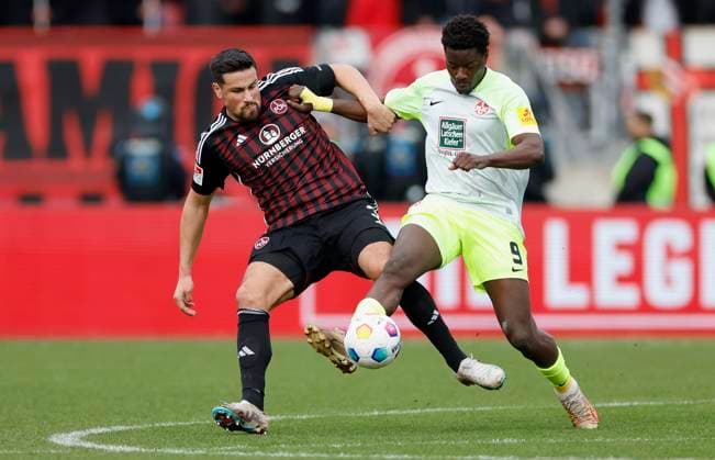 Picture from left Ahmet Guerleyen 1 FC Nuernberg, 3 and Ragnar Ache 1 FC Kaiserslautern, 9 18 02 2024, Soccer, 2 Bundesliga, 1 FC Nuernberg 1 FC Kaiserslautern, GER, Nuernberg, Max Morlock Stadion DFL REGULATIONS PROHIBIT ANY USE OF PHOTOGRAPHS AS IMAGE SEQUENCES AND OR QUASI VIDEO Copyright: HMBxMedia xHeikoxBecker