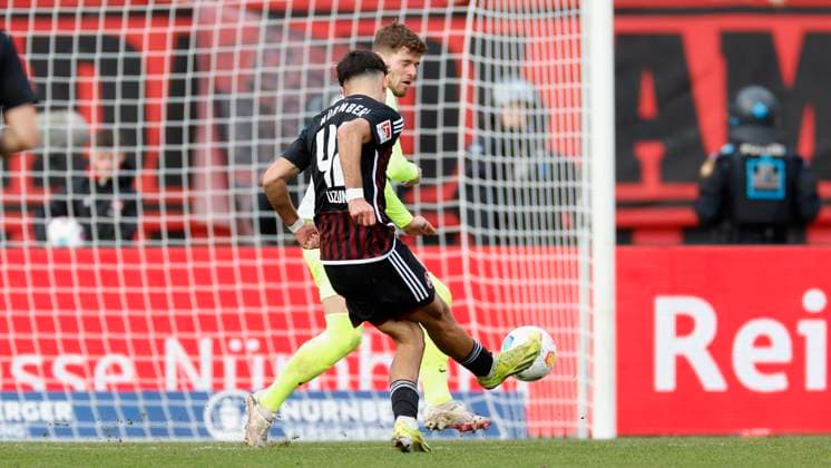 Picture from left Can Uzun 1 FC Nuernberg, 42 , Goal scored, scored the goal to 1 1 celebrate the goal, Jan Elvedi 1 FC Kaiserslautern, 33 18 02 2024, Football, 2 Bundesliga, 1 FC Nuernberg 1 FC Kaiserslautern, GER, Nuernberg, Max Morlock Stadion DFL REGULATIONS PROHIBIT ANY USE OF PHOTOGRAPHS AS IMAGE SEQUENCES AND OR QUASI VIDEO Copyright: HMBxMedia xHeikoxBecker
