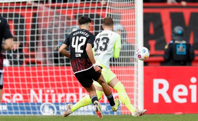 Picture from left Can Uzun 1 FC Nuernberg, 42 , Goal scored, scored the goal to 1 1 celebrate the goal, Jan Elvedi 1 FC Kaiserslautern, 33 18 02 2024, Football, 2 Bundesliga, 1 FC Nuernberg 1 FC Kaiserslautern, GER, Nuernberg, Max Morlock Stadion DFL REGULATIONS PROHIBIT ANY USE OF PHOTOGRAPHS AS IMAGE SEQUENCES AND OR QUASI VIDEO Copyright: HMBxMedia xHeikoxBecker