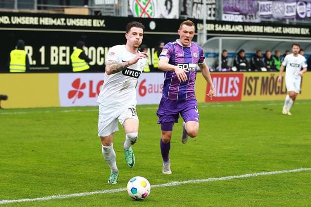 18 02 2024, xrhsx, Fußball 2 Bundesliga, SV Elversberg VfL Osnabrück emspor, v l Hugo Vandermersch SV Elversberg Thomas Goiginger VfL Osnabrueck Osnabrück Zweikampf, Aktion, action, battle for the ball DFL DFB REGULATIONS PROHIBIT ANY USE OF PHOTOGRAPHS as IMAGE SEQUENCES and or QUASI VIDEO Elversberg