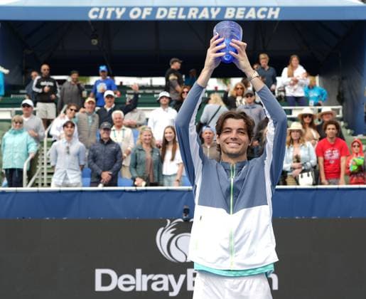 DELRAY BEACH, FL - FEBRUARY 19: Taylor Fritz (USA) poses with the Champions Trophy after winning the 2024 Delray Beach Open on February 19, 2024, at the Delray Beach Tennis Center in Delray Beach, FL.(Photo by Andrew Patron Icon Sportswire) TENNIS: FEB 19 Delray Beach Open EDITORIAL USE ONLY Icon2402198138