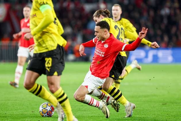 EINDHOVEN, 20-02-2024, Philips Stadium, UEFA Champions League season 2023 24, match between PSV and Borussia Dortmund, PSV player Sergino Dest and Borussia Dortmund player Marcel Sabitzer PSV - Borussia Dortmund  x24344960x Copyright: