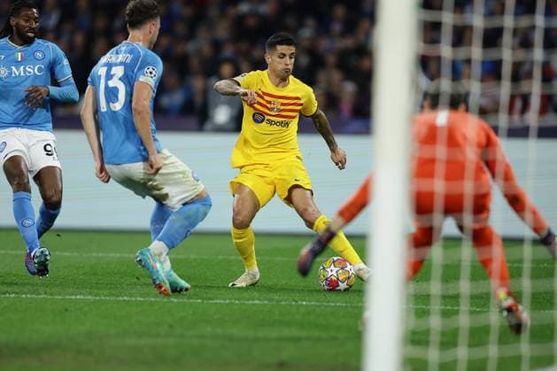 Champions League match SSC Napoli vs Barcellona Barcellona s Portuguese defender Joao Cancelo controls the ball during the UEFA Champions League round 16 match between SSC Napoli vs Barcellona at the Diego Armando Maradona Stadium in Naples, southern Italy, on February 21, 2024. ABPH2360 Copyright: xAntonioxBalascox