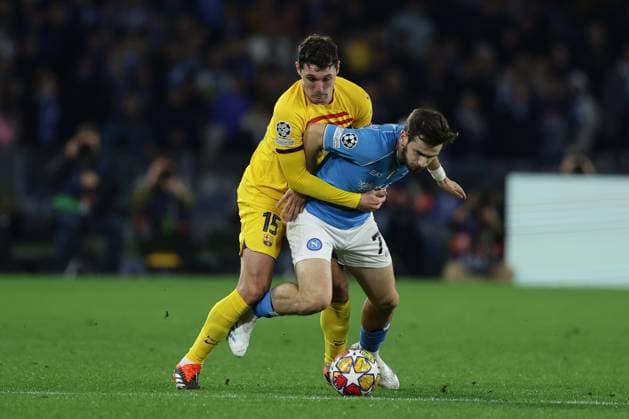 Champions League match SSC Napoli vs Barcellona Barcellona s Danish defender Andreas Christensen challenges for the ball with SSC Napoli™s forward Khvicha Kvaratskhelia during the UEFA Champions League round 16 match between SSC Napoli vs Barcellona at the Diego Armando Maradona Stadium in Naples, southern Italy, on February 21, 2024. ABPH2559 Copyright: xAntonioxBalascox