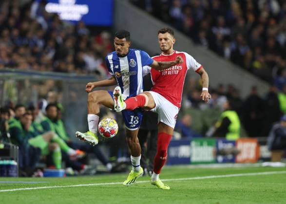 Porto, Portugal, 21st February 2024. Galeno of FC Porto challenged by Ben White of Arsenal during the UEFA Champions League match at the Estadio do Dragao, Porto. Picture credit should read: David Klein Sportimage EDITORIAL USE ONLY. No use with unauthorised audio, video, data, fixture lists, club league logos or live services. Online in-match use limited to 120 images, no video emulation. No use in betting, games or single club league player publications. SPI-2957-0031
