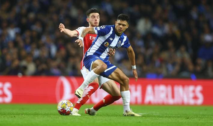 Declan Rice of Arsenal and Evanilson of Porto in action Porto v Arsenal, UEFA Champions League, Round of 16, First Leg, Football, Estadio do Dragao, Porto, Portugal - 21 Feb 2024 EDITORIAL USE ONLY No use with unauthorised audio, video, data, fixture lists, club league logos or live services. Online in-match use limited to 120 images, no video emulation. No use in betting, games or single club league player publications. Copyright: xKieranxMcManus Shutterstockx 14355127am