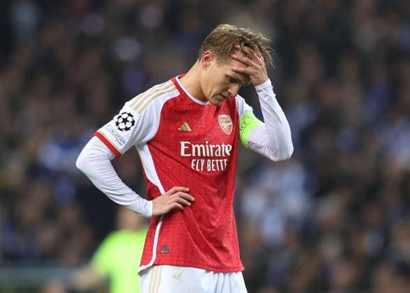 Porto, Portugal, 21st February 2024. Martin Odegaard of Arsenal reacts during the UEFA Champions League match at the Estadio do Dragao, Porto. Picture credit should read: David Klein Sportimage EDITORIAL USE ONLY. No use with unauthorised audio, video, data, fixture lists, club league logos or live services. Online in-match use limited to 120 images, no video emulation. No use in betting, games or single club league player publications. SPI-2957-0042