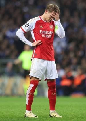 Porto, Portugal, 21st February 2024. Martin Odegaard of Arsenal reacts during the UEFA Champions League match at the Estadio do Dragao, Porto. Picture credit should read: David Klein Sportimage EDITORIAL USE ONLY. No use with unauthorised audio, video, data, fixture lists, club league logos or live services. Online in-match use limited to 120 images, no video emulation. No use in betting, games or single club league player publications. SPI-2957-0043