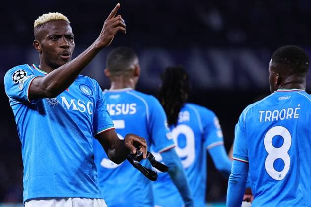 Victor Osimhen of SSC Napoli celebrates with team mates after scoring the goal of 1-1 during the Champions League football match between SSC Napoli and FC Barcelona, Barca at Diego Armando Maradona stadium in Naples (Italy), February 21st, 2024. cesarexpurini