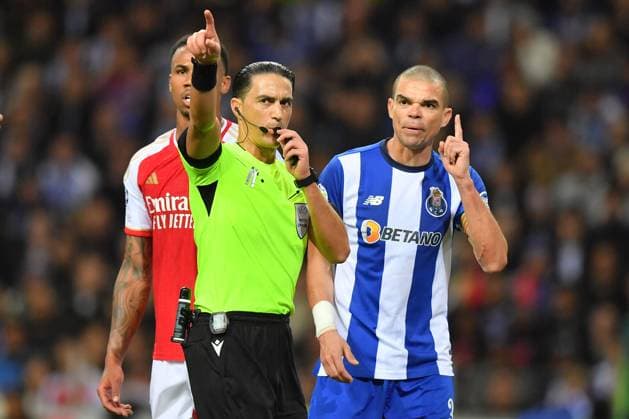 21st February 2024: Dragon Stadium, Porto, Portugal; Champions League football. FC Porto versus Arsenal FC: Referee Serdar Gozubuyuk (NED) shows Pepe of Porto his decision  ActionPlus12610915 DanielxCastro