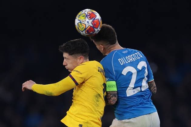 Naples, Italy, 21st February 2024. Giovanni Di Lorenzo of SSC Napoli heads clear from Robert Lewandowski of FC Barcelona, Barca during the UEFA Champions League match at Stadio Diego Armando Maradona, Naples. Picture credit should read: Jonathan Moscrop Sportimage EDITORIAL USE ONLY. No use with unauthorised audio, video, data, fixture lists, club league logos or live services. Online in-match use limited to 120 images, no video emulation. No use in betting, games or single club league player publications. SPI-2940-0067