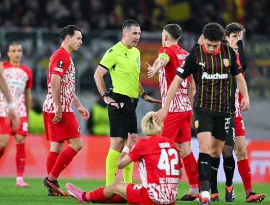Germany, Freiburg, 22 02 2024, Europa Park Stadion, SC Freiburg vs RC Lens UEFA Europa League, Referee Rade Obrenovic speaks with players Freiburg Europa Park Stadion Baden Wuerttemberg Germany eu-images-738