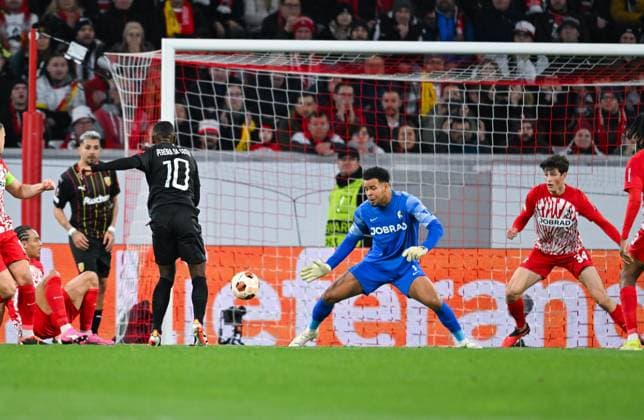 Germany, Freiburg, 22 02 2024, Europa Park Stadion, SC Freiburg vs RC Lens UEFA Europa League, David Costa RC Lens scores against Noah Atubolu SC Freiburg the first goal for his team Freiburg Europa Park Stadion Baden Wuerttemberg Germany eu-images-738