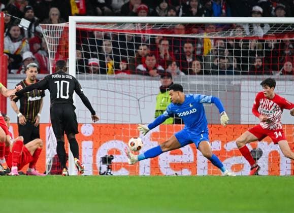 Germany, Freiburg, 22 02 2024, Europa Park Stadion, SC Freiburg vs RC Lens UEFA Europa League, David Costa RC Lens scores against Noah Atubolu SC Freiburg the first goal for his team Freiburg Europa Park Stadion Baden Wuerttemberg Germany eu-images-738