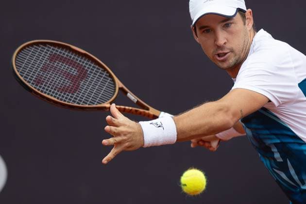 (240223) -- RIO DE JANEIRO, Feb. 23, 2024 -- Dusan Lajovic of Serbia hits a return during the round 16 match against Laslo Djere of Serbia at the 2024 ATP500 Rio Open at Jockey Club Brasileiro in Rio de Janeiro, Brazil, Feb. 22, 2024. ) (SP)BRAZIL-RIO DE JANEIRO-TENNIS-ATP500-RIO OPEN WangxTiancong 