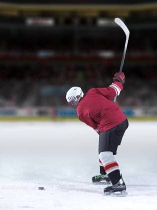 Ice hockey, Eishockey player in action ice hockey player in action kicking with stick (License=RF) 10481001 ,model released, Symbolfoto Copyright: xZoonar.com benisxarapovicx 10481001 ,model released, Symbolfoto ,property released