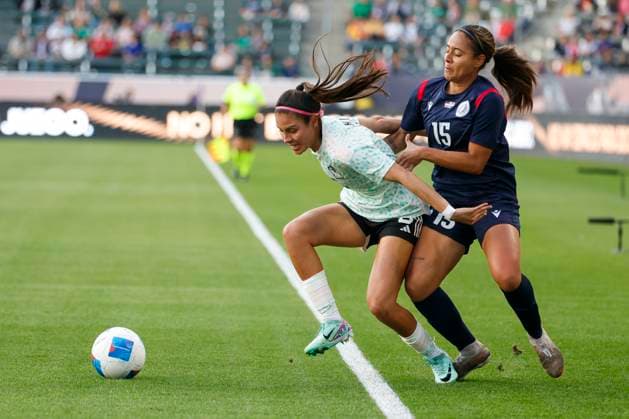 February 23, 2024, Los Angeles, California, USA: Mexico s KAREN LUNA 5 and Dominican Republic s KATHRYNN GONZALEZ 15 vie for the ball during a 2024 Concacaf Women Gold Cup soccer game in Carson, Calif. on Friday February 23, 2024. Los Angeles USA - ZUMAc68_ 20240223_zaf_c68_007 Copyright: xRingoxChiux