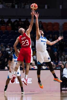 February 23, 2024, St. Catharines, On, Canada: Canada s Phil Scrubb (23) jumps for a ball with of Andy Perez (11) of Nicaragua during first half FIBA AmeriCup qualification play in St. Catharines, Ont., Friday, February 23, 2024. Canada News - February 23, 2024  - ZUMAc35_ 20240223_zaf_c35_165 Copyright: xNickxIwanyshynx