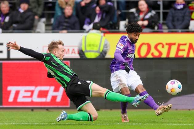 Jannik Dehm Hannover 96 and Noel Niemann VfL Osnabrueck fight for the ball, 2 Bundesliga, VfL Osnabrueck vs Hannover 96, Bremer Bruecke, 24 02 2024, Osnabrueck, Germany