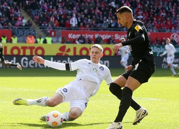 David Herold 20, Karlsruher SC gets the ball from Kenny Prince Redondo 11, FC Kaiserslautern 24 02 2024, Football, 2 Bundesliga, FC Kaiserslautern Karlsruher SC, Matchday 23, Season 2023 24, Fritz Walter Stadion, Kaiserslautern, Germany, zmdz, DFB DFL regulations prohibit any use of photographs as image sequences and or quasi video FC Kaiserslautern Karlsruher SC