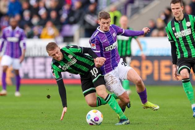 Sebastian Ernst Hannover 96 and Michael Cuisance VfL Osnabrueck fight for the ball, 2 Bundesliga, VfL Osnabrueck vs Hannover 96, Bremer Bruecke, 24 02 2024, Osnabrueck, Germany