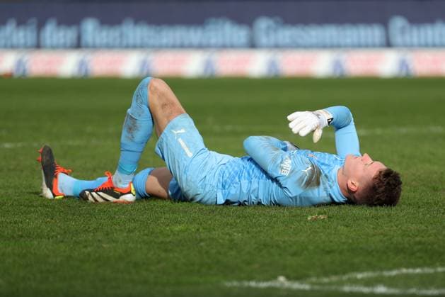 Braunschweig vs Berlin, 2 BL Braunschweig, 24 02 2024, FOOTBALL Eintracht Braunschweig vs Hertha BSC Berlin, 2 BL, Season 2023 24 Goalkeeper Ron Thorben Hoffmann Eintracht Braunschweig lies injured on the ground Braunschweig