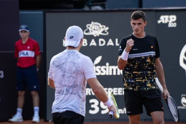 (240226) -- RIO DE JANEIRO, Feb. 26, 2024 -- Lucas Miedler Alexander Erler (R) of Austria celebrates scoring during the men s doubles final between Lucas Miedler Alexander Erler of Austria and Nicolas Barrientos of Colombia Rafael Matos of Brazil at the 2024 ATP500 Rio Open at Jockey Club Brasileiro in Rio de Janeiro, Brazil, Feb. 25, 2024. ) (SP)BRAZIL-RIO DE JANEIRO-TENNIS-RIO OPEN-MEN S DOUBLES-FINAL WangxTiancong 