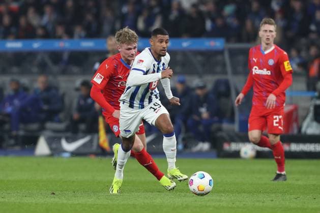 01 03 2024, xtgx, Soccer 2 Bundesliga, Hertha BSC Berlin Holstein Kiel emspor, v l Jonjoe Kenny Hertha, 16 am Ball, plays the ball DFL DFB REGULATIONS PROHIBIT ANY USE OF PHOTOGRAPHS as IMAGE SEQUENCES and or QUASI VIDEO Berlin